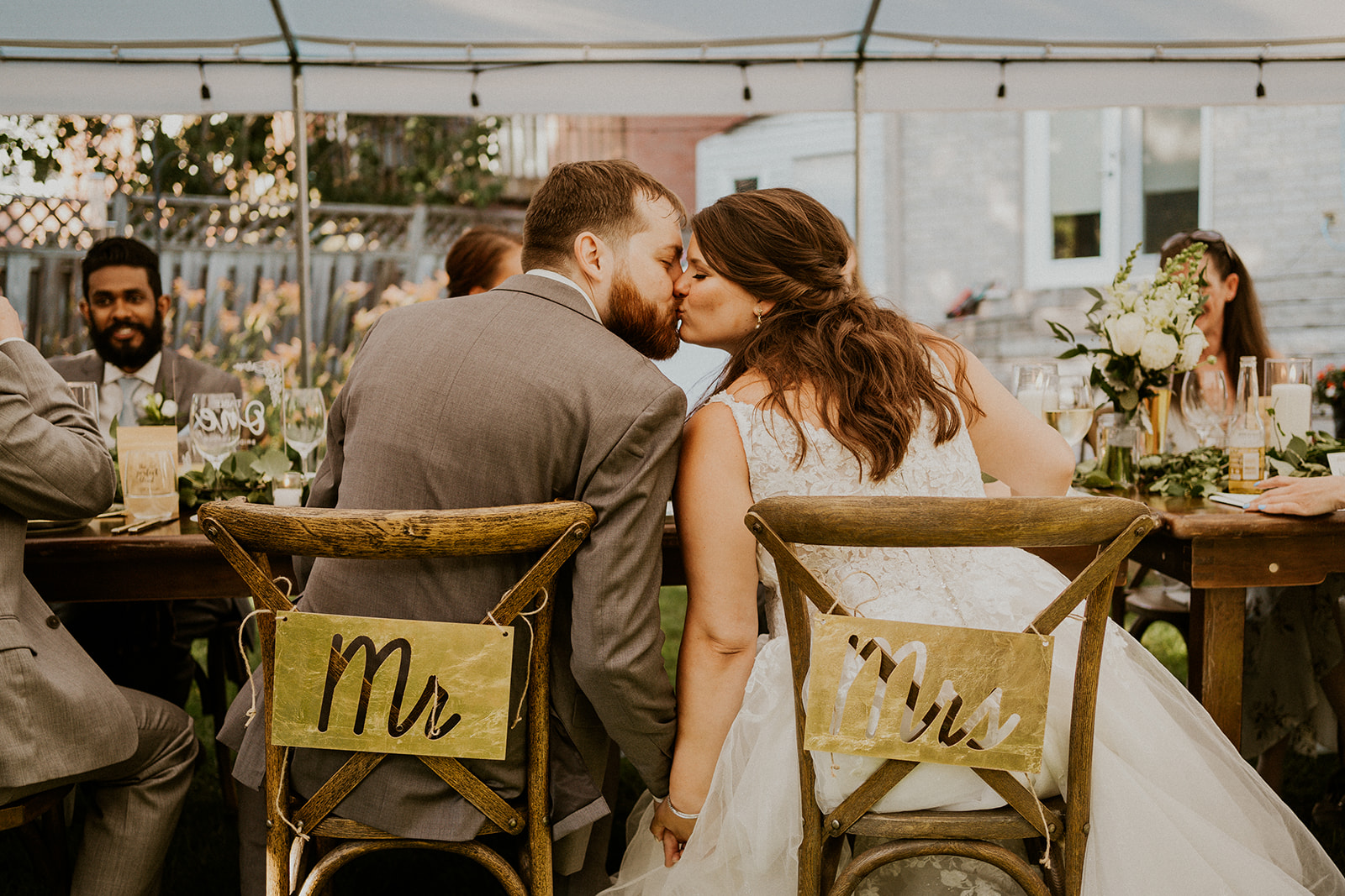 Alana and Shawn kissing during their reception