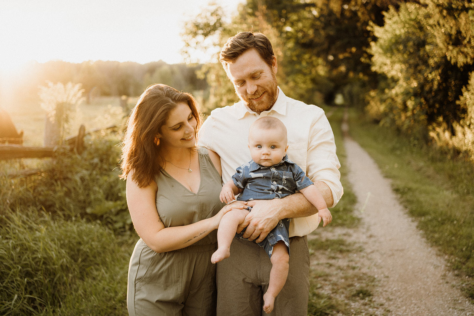 A family of three walking down the path.