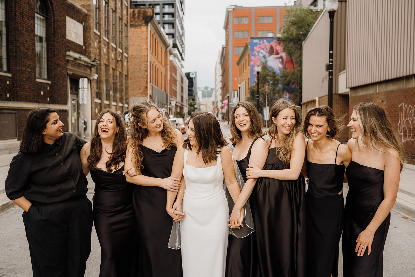 The bridal party standing outside with the bride.