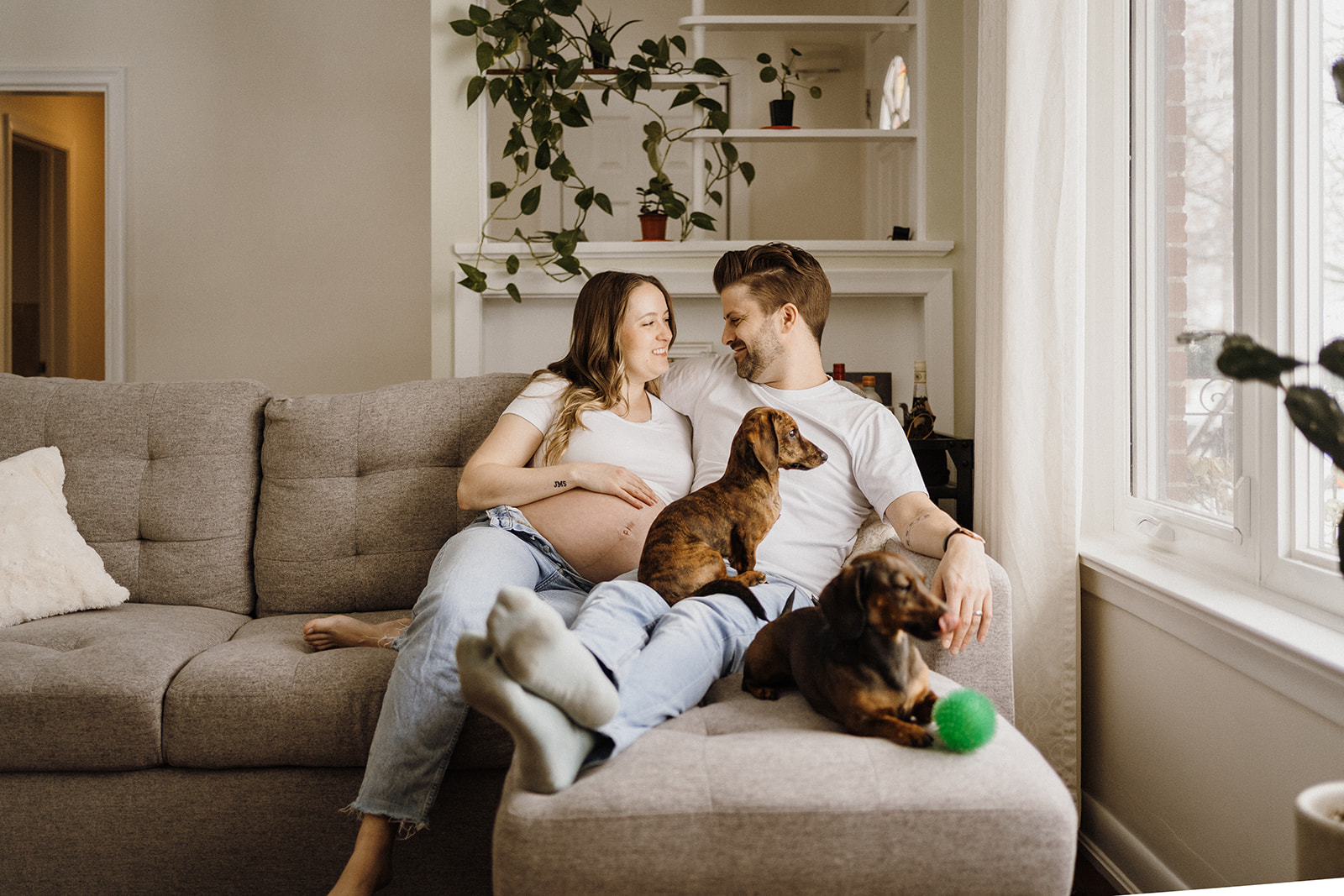 Two people sitting on the couch.